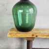 Large antique green blown glass demijohn (France, c.1900)