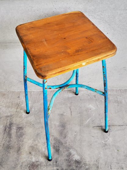 Vintage metal industrial style stool with metal legs and a 70 cm high solid wood seat (France, c.1950).