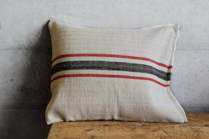 Antique sack cushion with red and black stripe