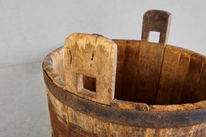 Antique oak wood bucket used during the grape harvest (France, c.1950).