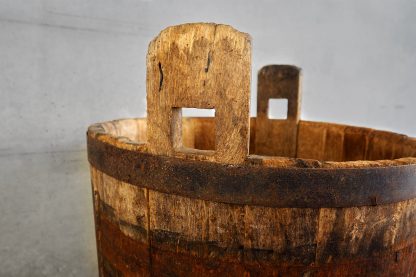 Antique oak wood bucket used during the grape harvest (France, c.1950).