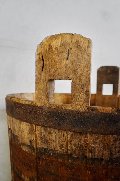 Antique oak wood bucket used during the grape harvest (France, c.1950).