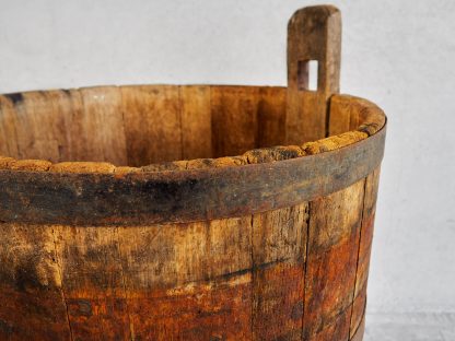 Antique oak wood bucket used during the grape harvest (France, c.1950).