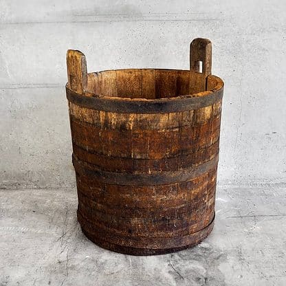 Antique oak wood bucket used during the grape harvest (France, c.1950).