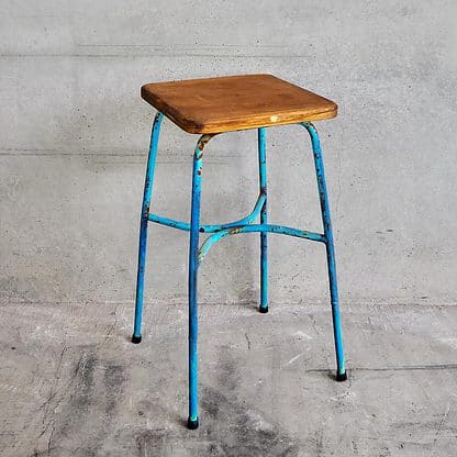 Vintage metal industrial style stool with metal legs and a 70 cm high solid wood seat (France, c.1950).