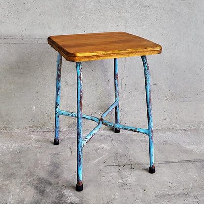 Industrial style metal and wood stool with iron legs and a 50 cm high solid wood square seat (France, c.1950).