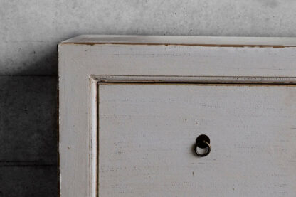 White chest of drawers in aged wood