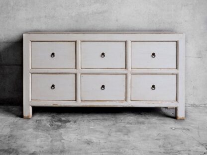 White chest of drawers in aged wood