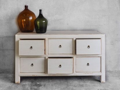 White chest of drawers in aged wood