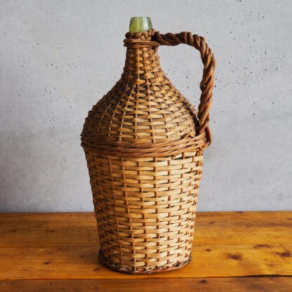 Decorative wicker bottle made of glass (France, c.1920).