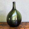 Bouteille ovale ancienne verre vert (vers 1920)
