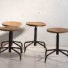 Industrial style round stools (c.1950). Set of 4 pieces
