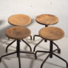 Industrial style round stools (c.1950). Set of 4 pieces