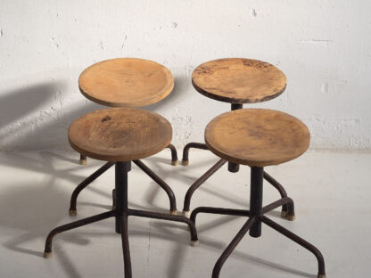 Industrial style round stools (c.1950). Set of 4 pieces